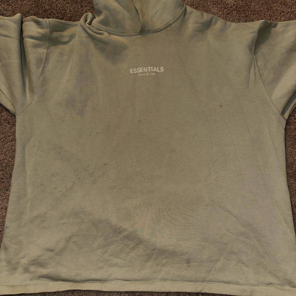 A few spots on the hoodie. Not noticeable really. Photo was taken with flash.